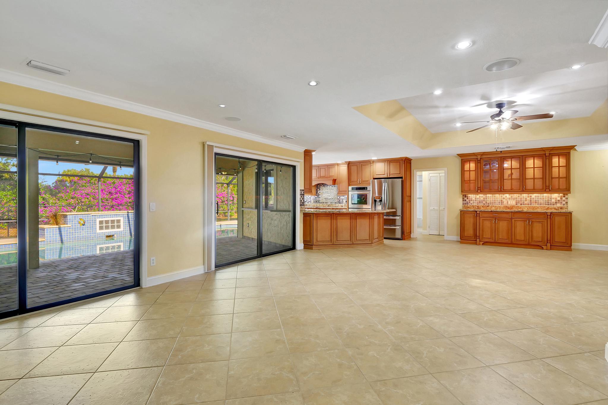There Is a Double Set of Sliders With Sliding Blinds and Screens Leading to/From the Lanai